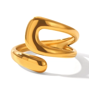 Macro detail of a high-polished golden spiral wrap ring with modern minimalist design