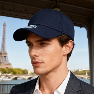 Classic dark blue fitted cotton baseball cap worn by male model with Eiffel Tower backdrop