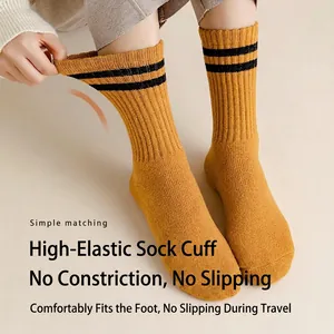 Thick ginger wool crew socks with double black stripes and high elastic ribbed cuffs