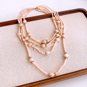 French court style multi-layer peach beaded necklace with gold diamond-set accents
