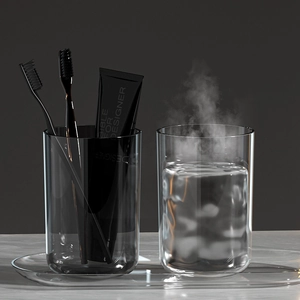 Minimalist transparent glass mouthwash cup set with two glasses and oval tray on marble