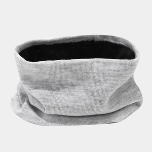 Detail of grey knitted winter neck warmer showing thick black fleece lining and soft texture