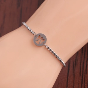 Silver stainless steel angel charm bracelet on wrist with polished square links