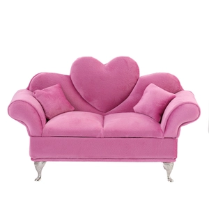 Pink heart-shaped velvet jewelry storage sofa with silver legs and two small pillows