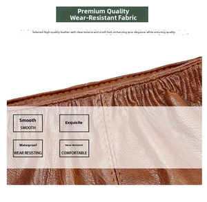 Close-up of brown litchi grain faux leather with durable stitching on stylish bag