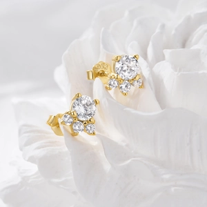 Detailed view of S925 sterling silver flower stud earrings with sparkling cubic zirconia
