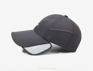 Detail view of the side retractable sun visor and breathable mesh on dark gray sports cap
