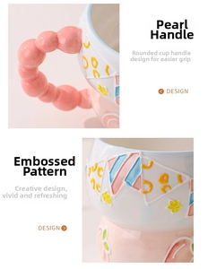 Detail view of the ceramic mug with a unique pearl bead handle and hand-painted relief pattern