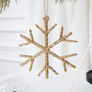 Sparkling gold snowflake Christmas ornament with glitter coating and hanging gold string