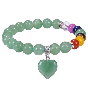 Detailed shot of 8mm green natural stone beads and chakra beads with a heart pendant