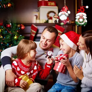 Family sharing gifts near Christmas tree with festive wooden gnome ornaments