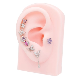 8-piece set of stainless steel butterfly and heart zircon studs on pink ear model