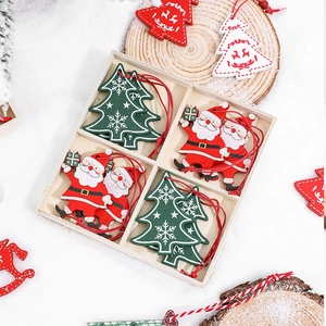 Wooden Christmas ornaments set with Santa and snowflake designs in a rustic wooden box