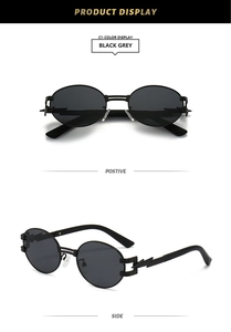 Detail view of oval steampunk sunglasses with black grey lenses and metallic frames