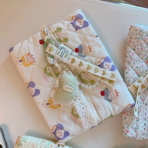 Quilted floral pouch detail with lace trim, pearl strap and heart charm decoration