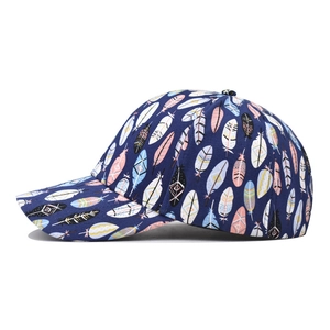 Navy blue cotton baseball cap featuring colorful feather print in a side-view profile