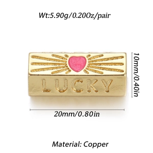 Detail of a 20mm gold-plated copper pendant featuring a pink heart and LUCKY engraving