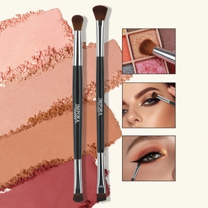 Dual-ended eyeshadow and eyeliner brush detail with soft synthetic bristles and matte handle
