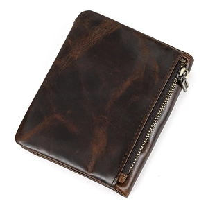 Detail of genuine dark brown crazy horse leather wallet with vertical zipper coin pocket