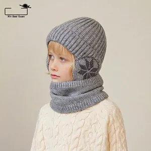 Kids grey knitted earflap hat and scarf set with snowflake patterns for winter warmth