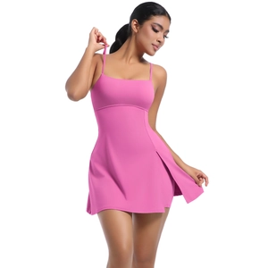 Detailed front view of pink tennis dress featuring slim straps and a side slit hemline