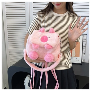 Detail of pink plush Capybara backpack with embroidery and metal chain strap