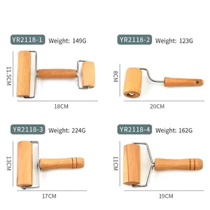Various beech wood rolling pins with stainless steel brackets for baking and dough