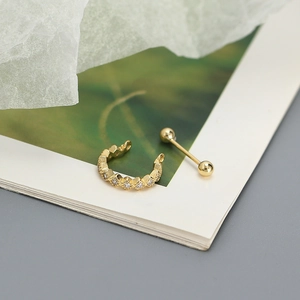 Detail of s925 silver gold-plated geometric earring set with shiny cubic zirconia