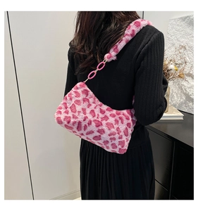 Detail of pink leopard faux fur shoulder bag with acrylic chain and plush strap