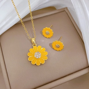 Sunflower jewelry set with sparkling crystals in gold and yellow enamel flower design