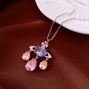 French luxury Saturn pendant necklace with purple crystal and colorful teardrop stones