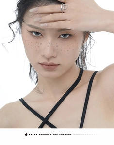 Close-up of a twisted irregular S925 silver ring worn by a model in a fashion shot