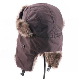 Detailed view of dark brown waterproof trapper hat with soft faux fur lining and plastic buckle