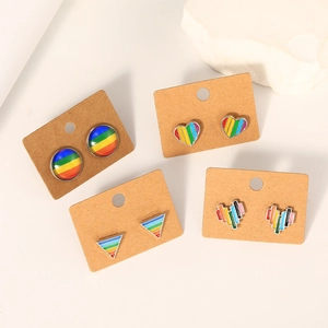Set of four pairs of rainbow enamel geometric earrings in heart and circle shapes