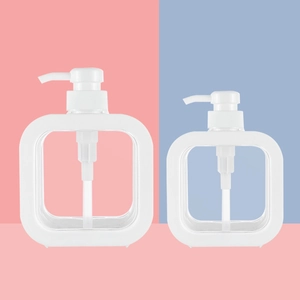 Set of two white square plastic refillable pump bottles for soap and lotion on colorful background