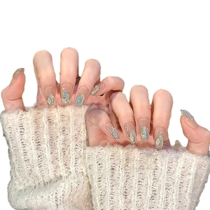 Pink and blue gradient press-on nails with glitter, seashells and rhinestones decoration