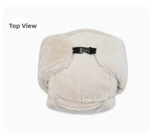 Top view of cream white faux fur trapper hat with black plastic buckle and thick lining