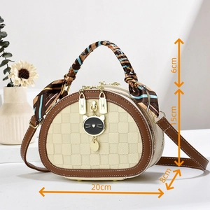 Detailed size view of beige checkerboard handbag with silk scarf handle and cat charm