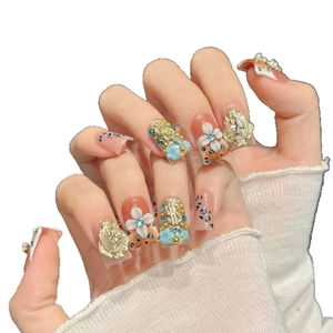 Handmade press-on nails with 3D white floral, gold relief, and leopard print designs
