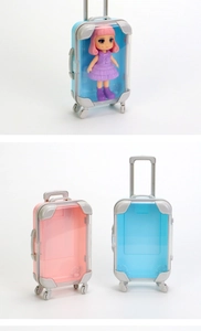 Miniature blue and pink travel suitcase toy models with retractable handles and wheels