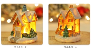 Detailed comparison of glowing resin Christmas house models F and G with snowy decor