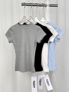 Close-up of four modal stretch slim-fit t-shirts in grey, black, white and blue colors