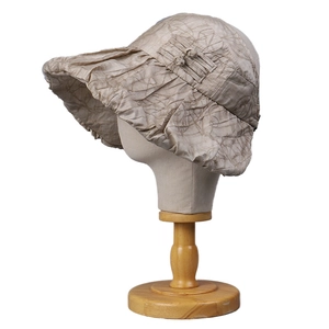 Khaki pleated tencel sun hat with wide brim for women, shown in a 45-degree side view