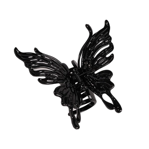 Large black hollow butterfly hair claw clip with a glossy finish and gothic style