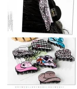 Detail of leopard and checkerboard patterned mini cowboy hat hair claws for women