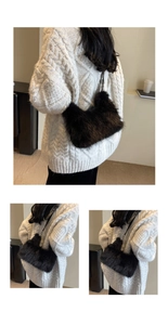 Detail of soft black faux fur shoulder bag texture with slim strap on a white sweater
