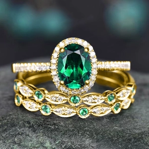 Luxury 18K gold plated oval green emerald ring set with halo diamonds on stone base