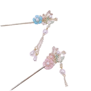 Traditional butterfly flower hair pins with tassels in blue and pink floral styles