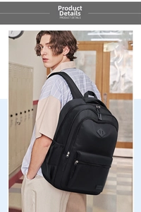Detail view of a black nylon backpack with multiple zipper pockets and brand logo
