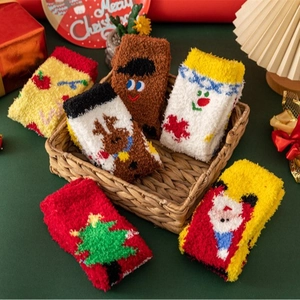 Pack of 6 Christmas coral fleece warm socks with festive embroidery in a cozy holiday setting